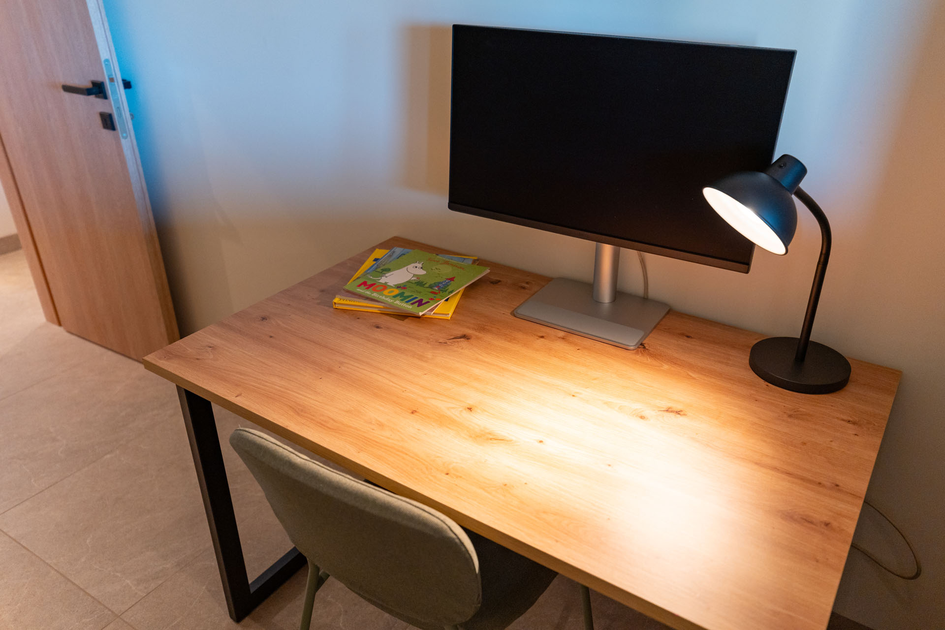 Desk with 27-inch monitor in the bunk bedroom